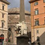 Another Bernini sculpture with the dome of the Pantheon in the background.