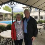 Barb and Paul with the beautiful pool at La Corte.