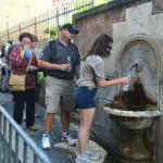 Trying out the fresh spring water at Il Nasone.