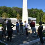 Learning about the cemetery from Phil.