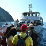 Boarding a boat for a cruise along the shore.