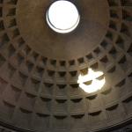 The shadow from the Oculus in the Pantheon.