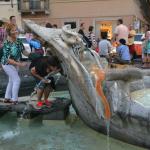 Sister misbehaving on the sinking boat fountain.