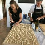 Nancy and Bill work on the pasta.