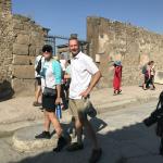 Judy and George cross the streets of Pompeii.