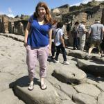 JyNohn on the stepping stones across the streets in Pompeii.