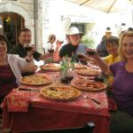 Enjoying pizza in Castellina.