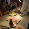 Adding the toppiings to the focacia